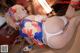 A woman in a kimono laying on the floor.